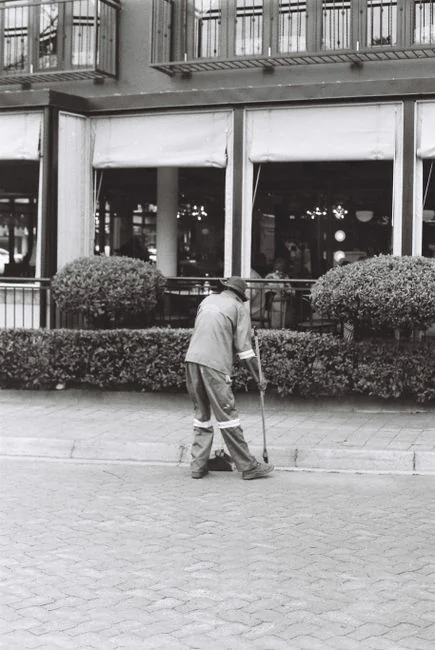 Cleaner cleaning the floor in a laboratory environment